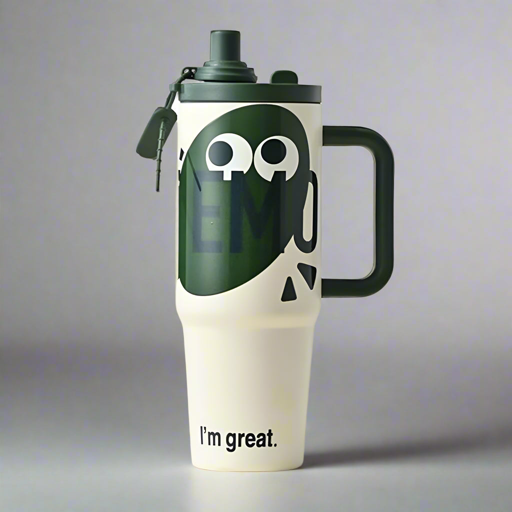 White tumbler with green lid and handle, featuring a smiley face and 'I'm great.' text on a gray background