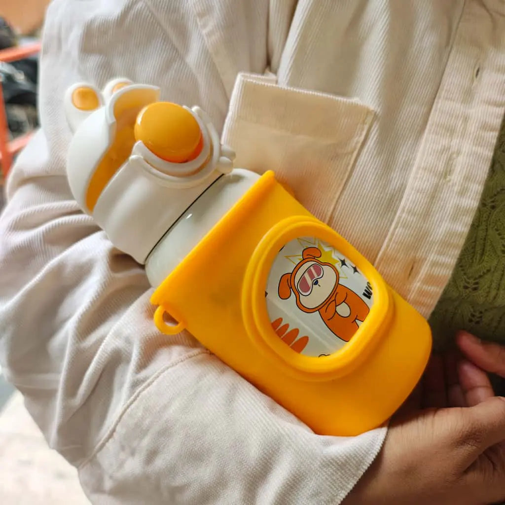 Yellow and white water bottle with cartoon character on a beige jacket