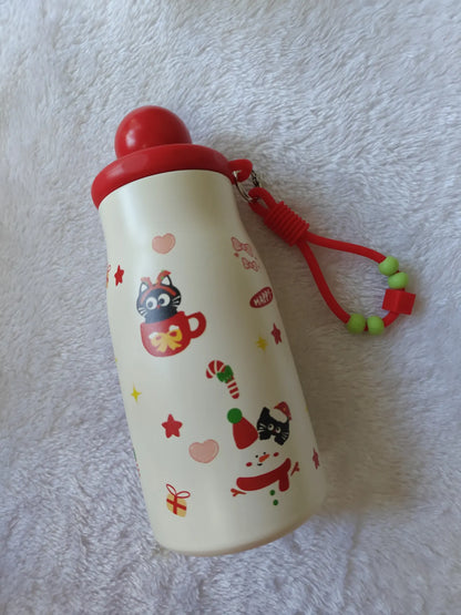 White water bottle with red lid and cat illustrations on a textured white background