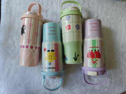 Four colorful children's thermos bottles with cartoon designs on a textured surface.