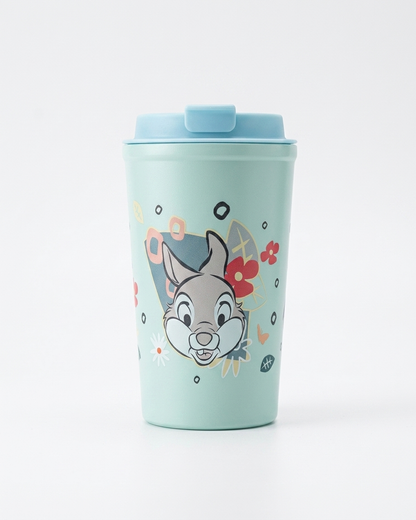 A mint green insulated travel tumbler with a light blue lid, featuring a cartoon rabbit character and colorful abstract details on the front, set against a plain white background.