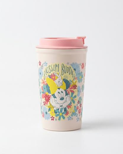 A travel tumbler with a light pink lid and a cream-colored body, decorated with a colorful floral pattern and a cartoon character. The text 'HOSSON BUDDIES' is printed above the character.