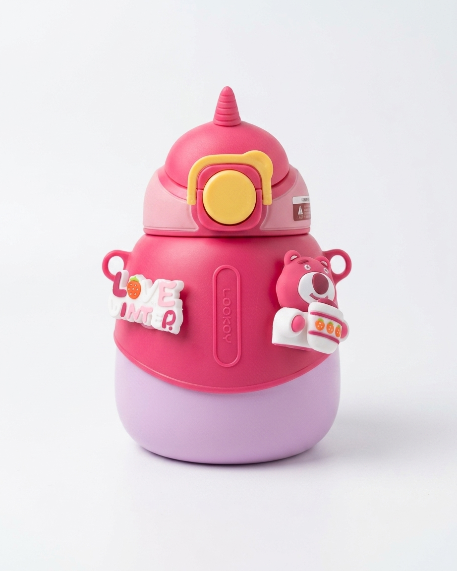 A pink and lavender water bottle with a cute character design, featuring a yellow circular button on the lid, side handles, and decorative stickers, shown on a clean white background.