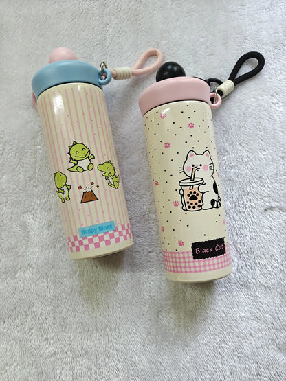 Two cartoon-themed water bottles on a gray surface