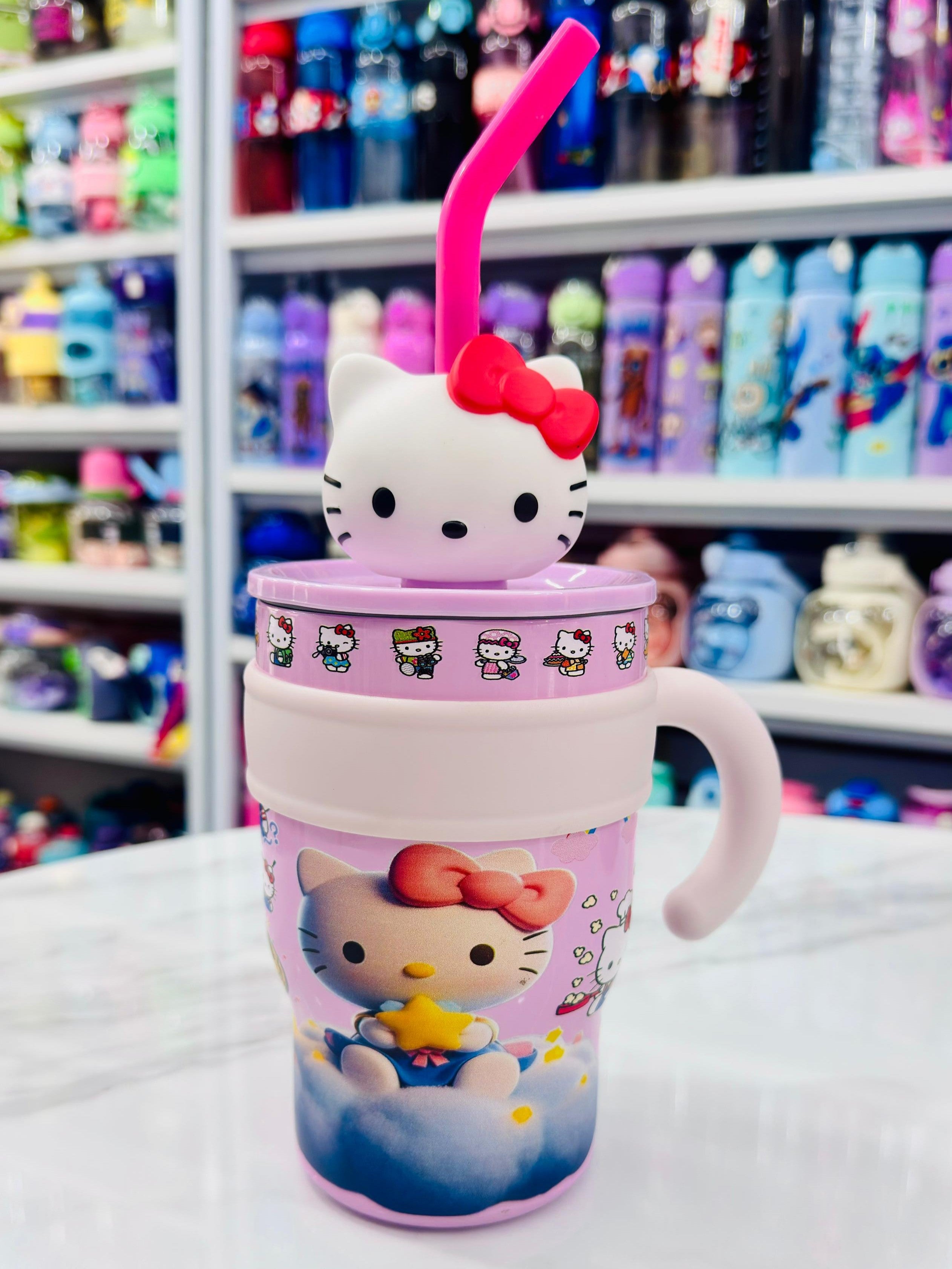 Hello Kitty-themed tumbler with a straw in a store setting