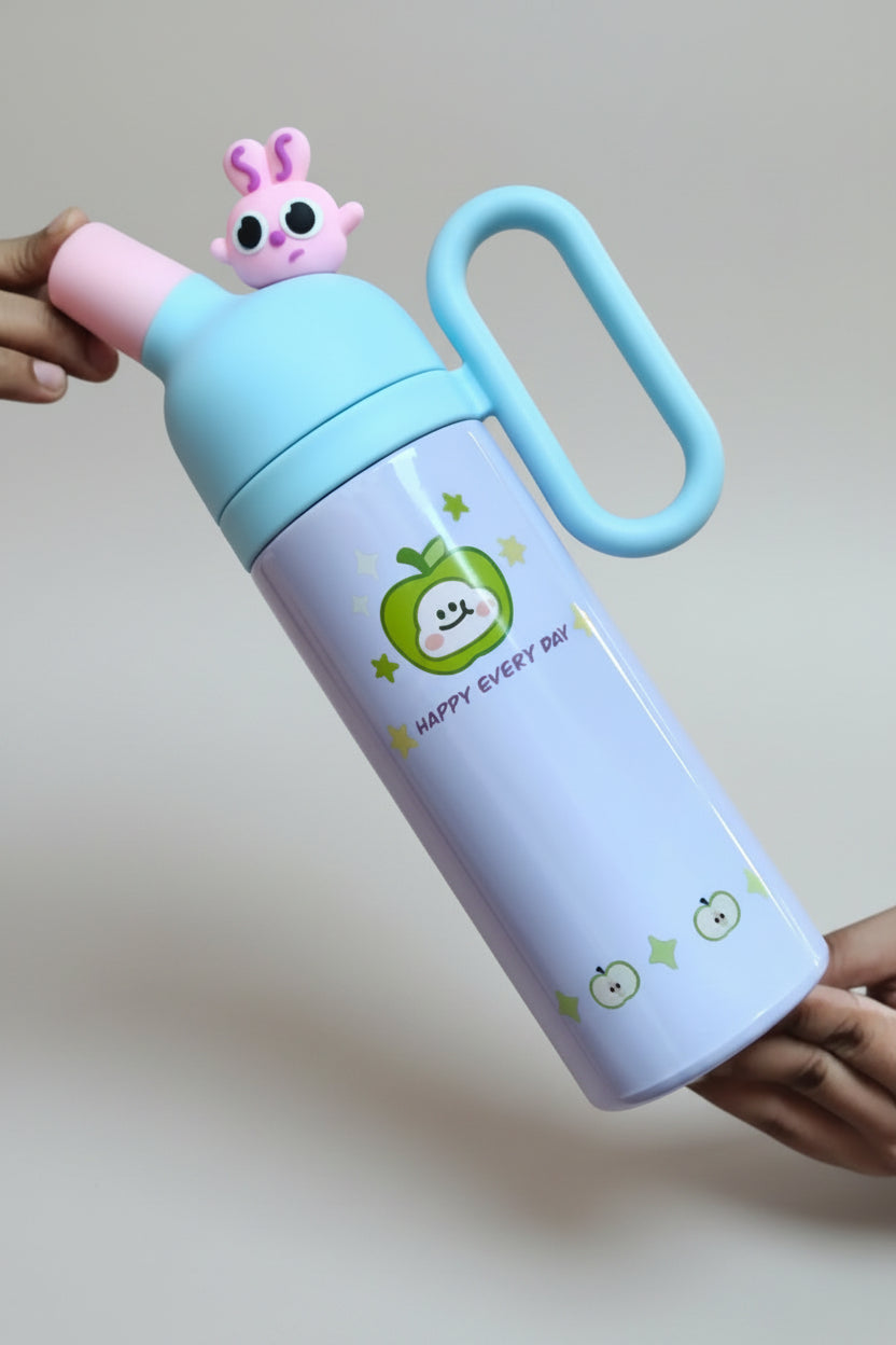 Children's thermos with cartoon design held by a person wearing a brown shirt.