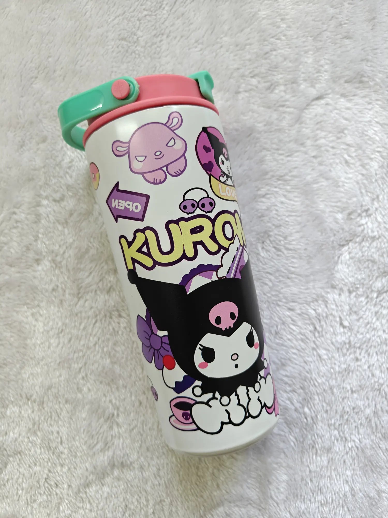 Kuru Kuru themed tumbler on a white fluffy background