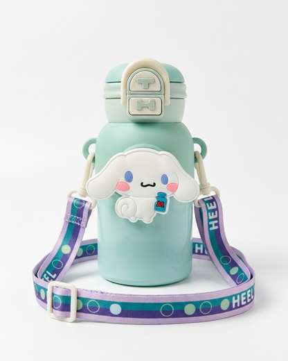 A mint green water bottle with a cute white cartoon character charm, a matching lid, and a purple and teal patterned shoulder strap on a light gray background.