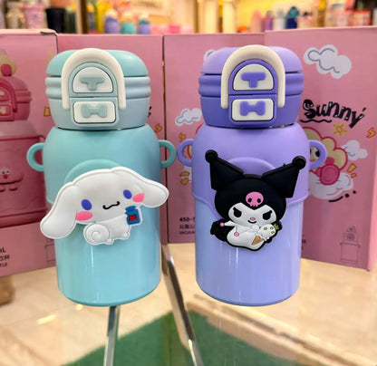 Two cartoon-themed water bottles on a stand with colorful packaging in the background.