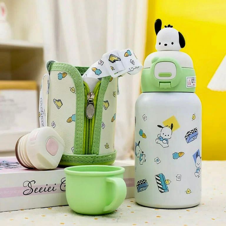 Set of green and white children's accessories including a water bottle, pouch, and cup on a yellow background.