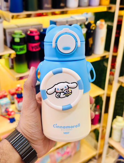 Cartoon character-themed water bottle held in a hand with a blurred store background