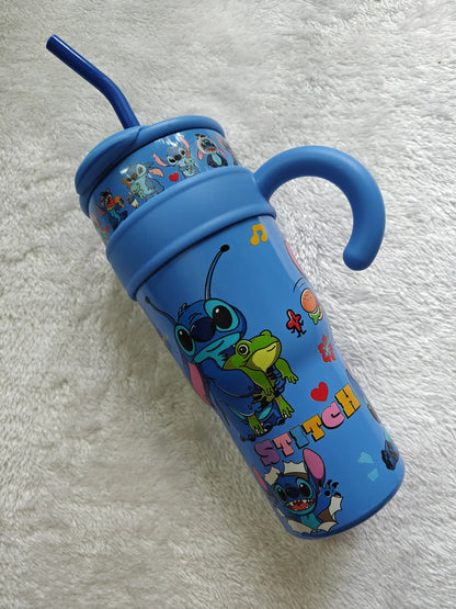 Blue tumbler with cartoon character design on a white textured background