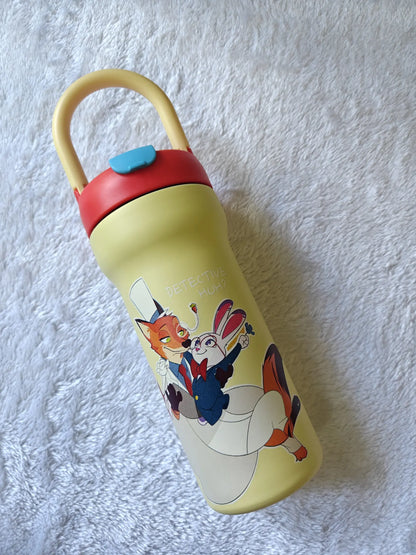 Children's water bottle with cartoon characters on a textured white surface